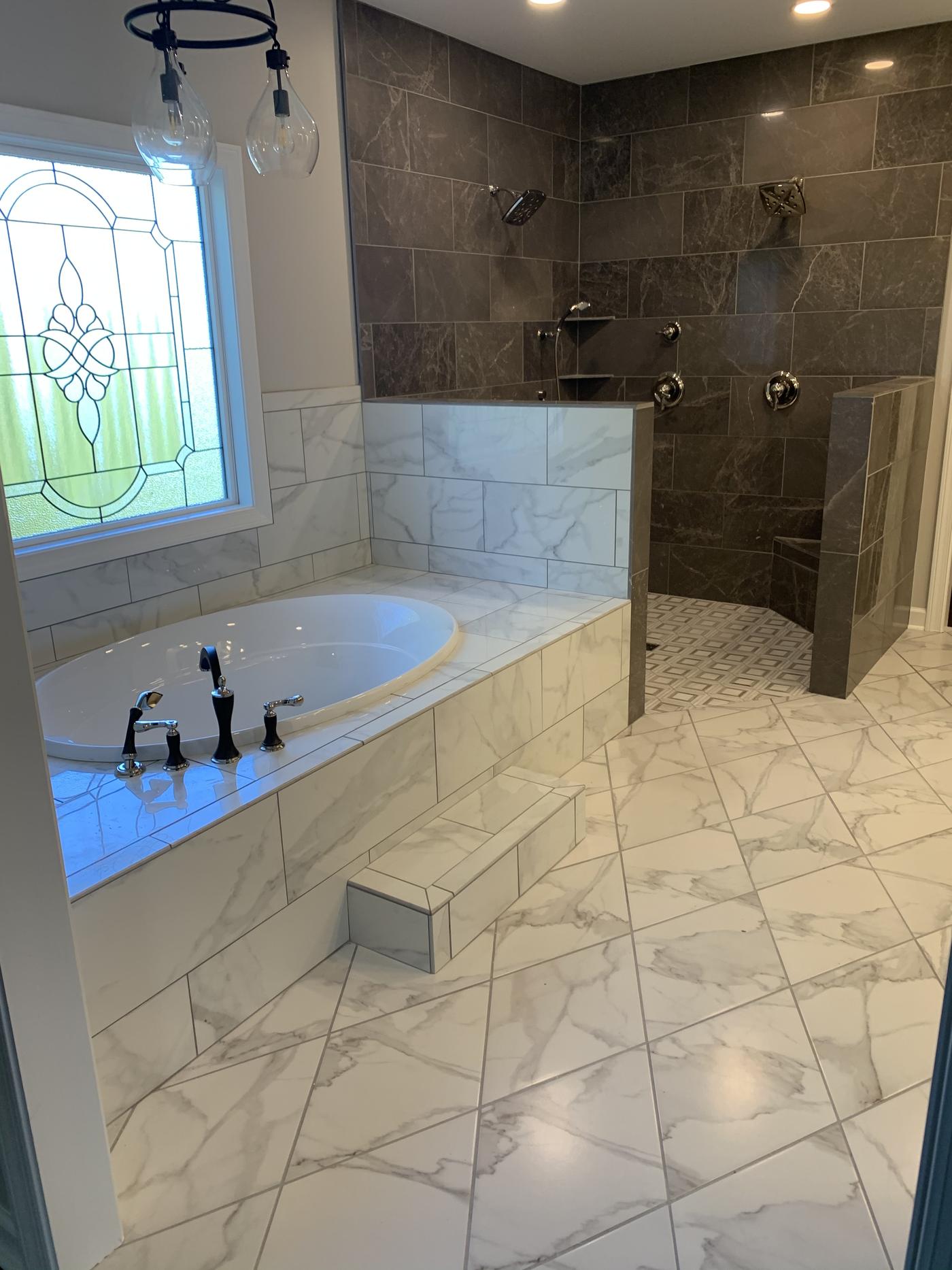 Master bath with tiled soaking tub and walk-in shower